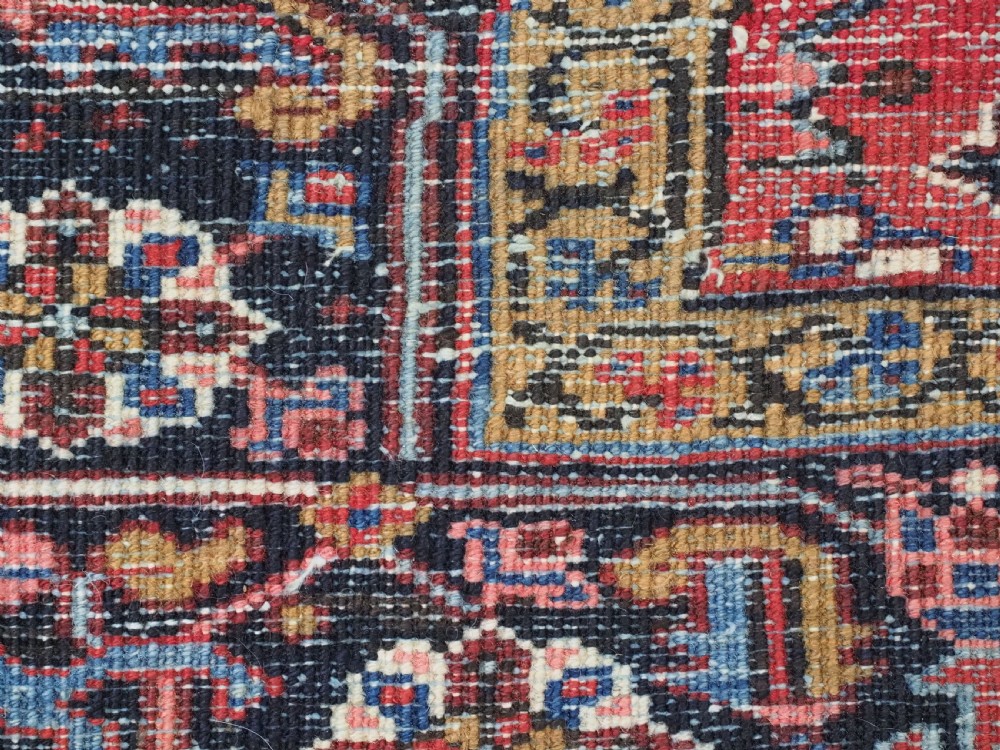 ANTIQUE HERIZ CARPET, ALL OVER DESIGN ON A BOLD RED GROUND, CIRCA 1920/30. View XIII