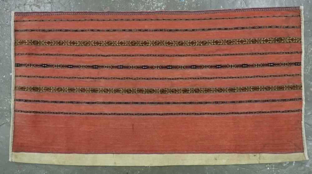 A pair of rectangular antique Turkmen Kizil chuval woven textiles in terracotta red with thin horizontal geometric bands and cream backing edges. View III