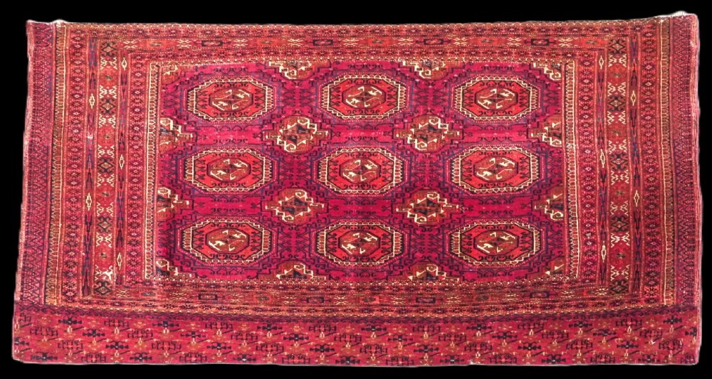 ANTIQUE TEKKE OR SARYK TURKMEN 9 GUL CHUVAL FACE, COCHINEAL DYE, CIRCA 1880.