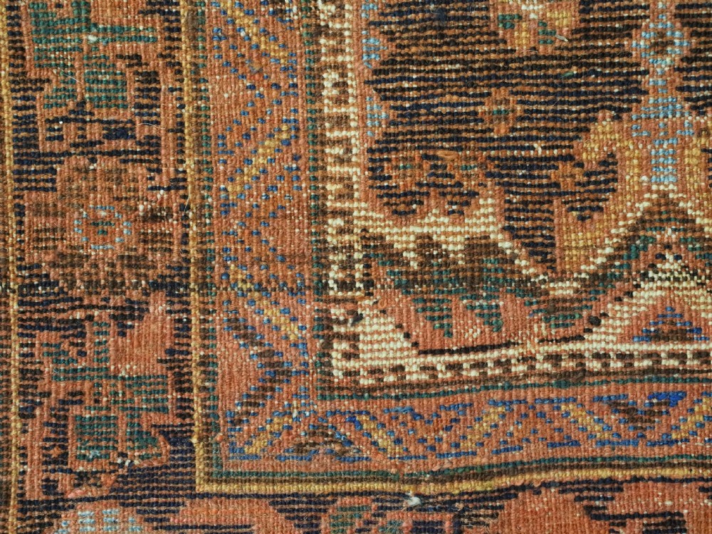 An antique hand-knotted Afshar wool rug featuring stylised dragon and phoenix motifs in blue, terracotta, and brown over an ivory ground within a geometric patterned border. View XV