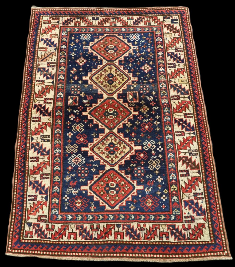 ANTIQUE CAUCASIAN GENDJE REGION SMALL KAZAK RUG, SUPERB COLOR, CIRCA 1890.