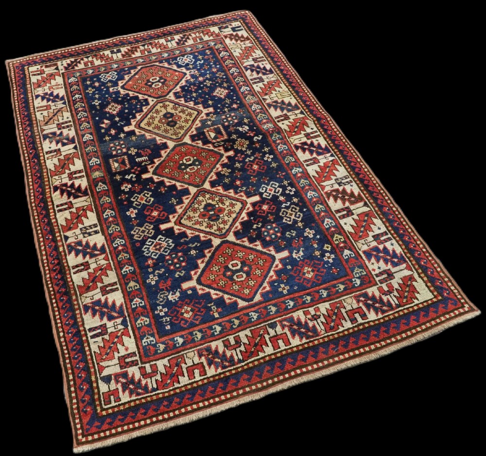 ANTIQUE CAUCASIAN GENDJE REGION SMALL KAZAK RUG, SUPERB COLOR, CIRCA 1890. View II