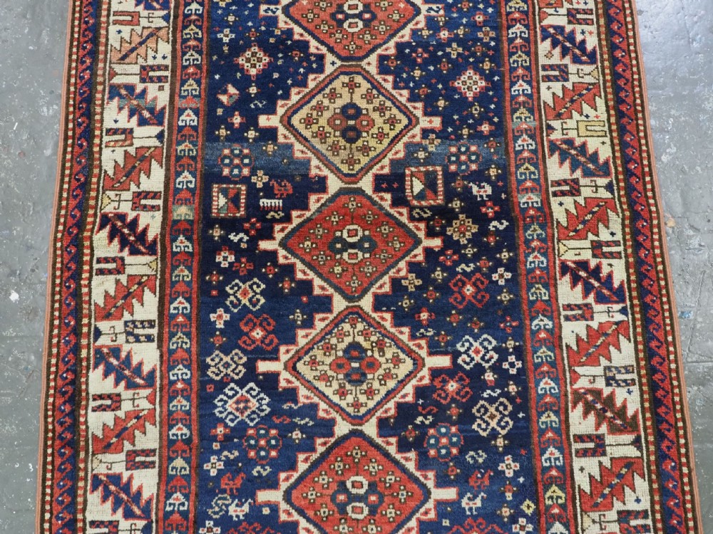 ANTIQUE CAUCASIAN GENDJE REGION SMALL KAZAK RUG, SUPERB COLOR, CIRCA 1890. View IV