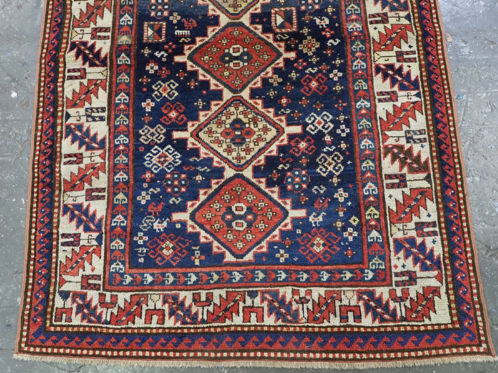 ANTIQUE CAUCASIAN GENDJE REGION SMALL KAZAK RUG, SUPERB COLOR, CIRCA 1890. View V