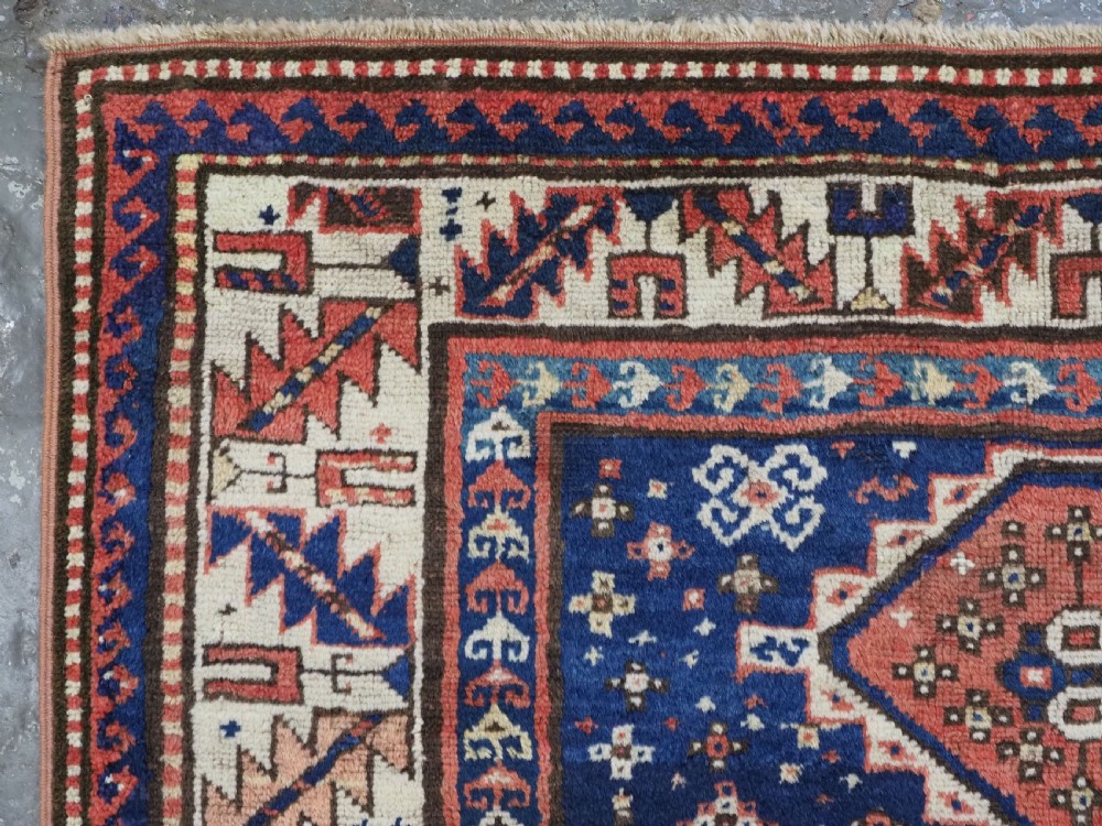 ANTIQUE CAUCASIAN GENDJE REGION SMALL KAZAK RUG, SUPERB COLOR, CIRCA 1890. View VI