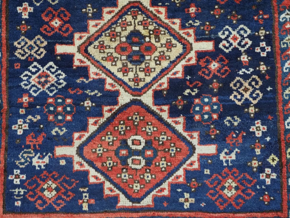 ANTIQUE CAUCASIAN GENDJE REGION SMALL KAZAK RUG, SUPERB COLOR, CIRCA 1890. View X