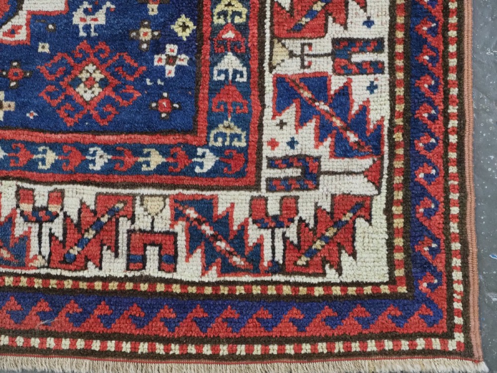 ANTIQUE CAUCASIAN GENDJE REGION SMALL KAZAK RUG, SUPERB COLOR, CIRCA 1890. View XII