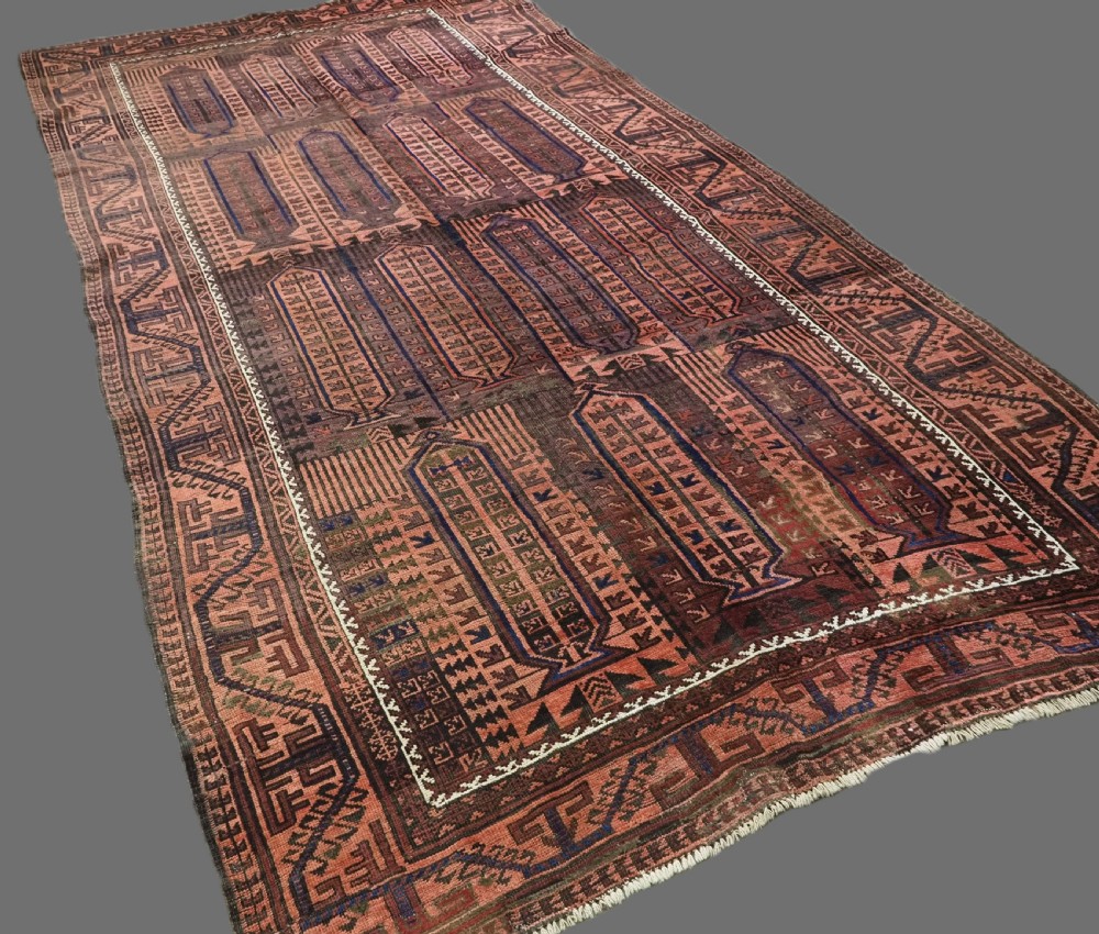 An antique hand-knotted wool carpet featuring a repeating kalam donneh pencil box pattern in shades of terracotta, dark brown, and indigo blue. View II