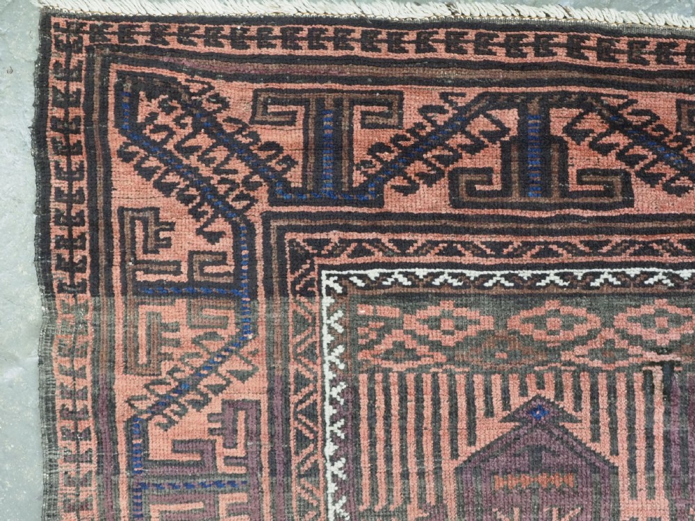 An antique hand-knotted wool carpet featuring a repeating kalam donneh pencil box pattern in shades of terracotta, dark brown, and indigo blue. View VII