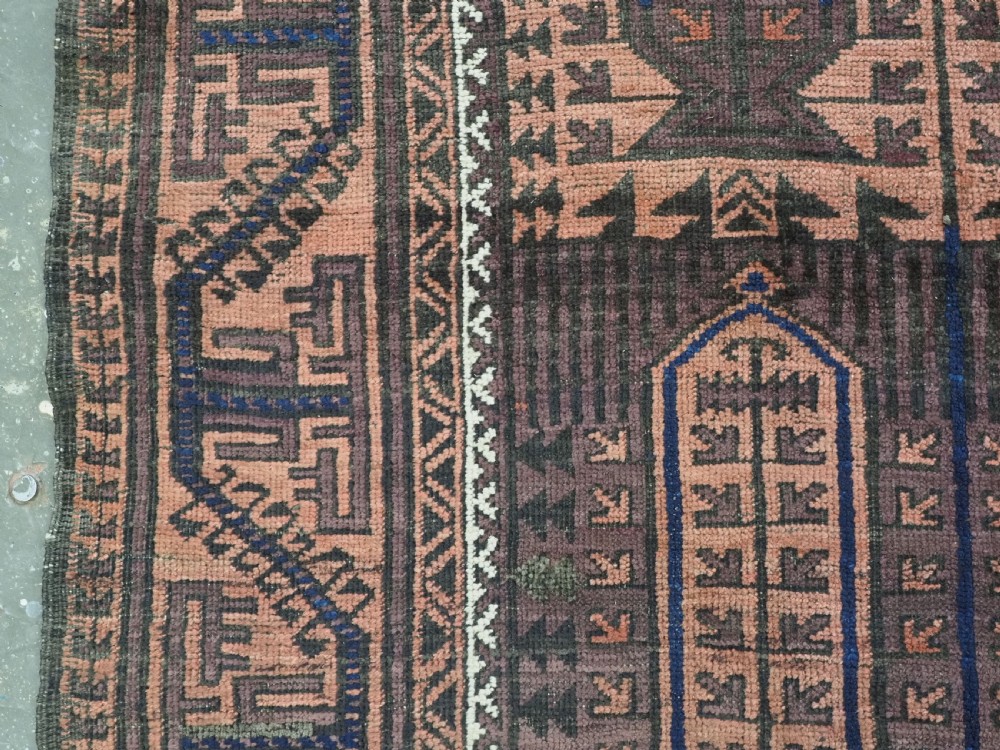 An antique hand-knotted wool carpet featuring a repeating kalam donneh pencil box pattern in shades of terracotta, dark brown, and indigo blue. View VIII