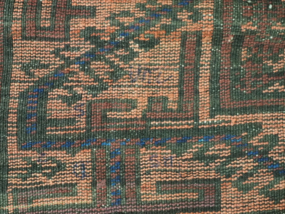 An antique hand-knotted wool carpet featuring a repeating kalam donneh pencil box pattern in shades of terracotta, dark brown, and indigo blue. View XVI