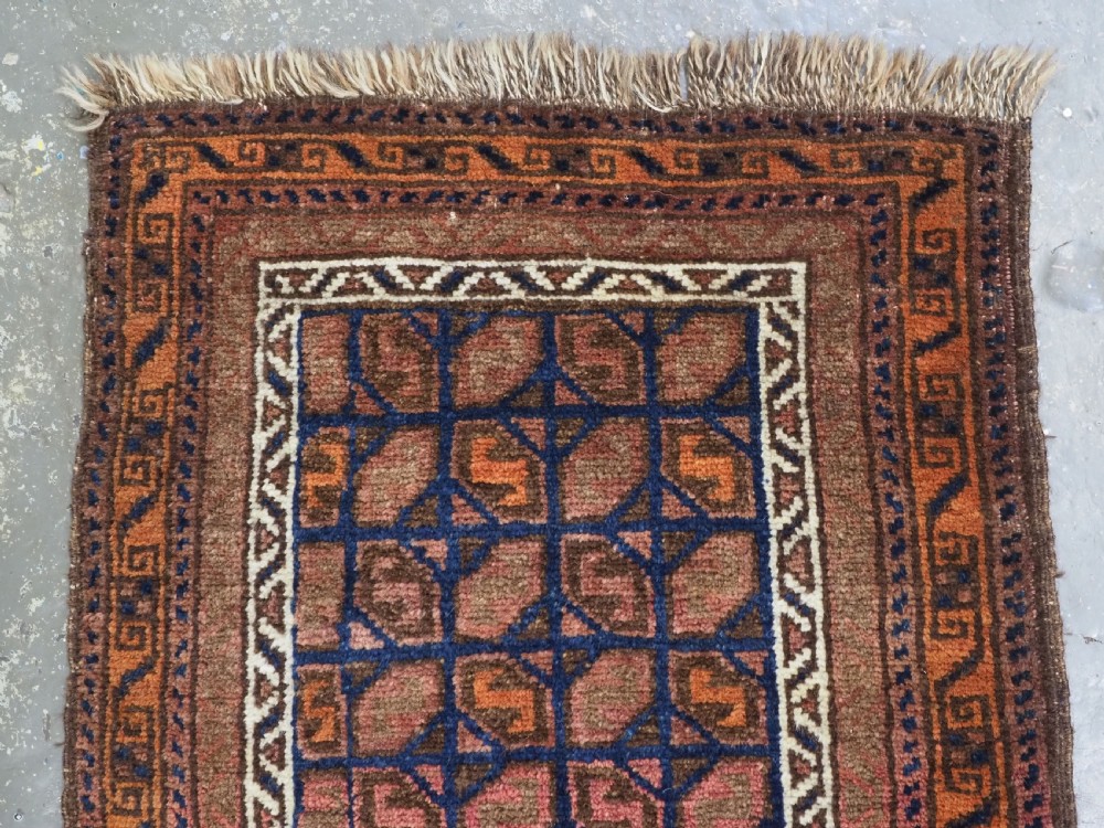 ANTIQUE AFGHAN BALUCH PUSHTI FACE WITH 'TILE' DESIGN, CIRCA 1900. View II
