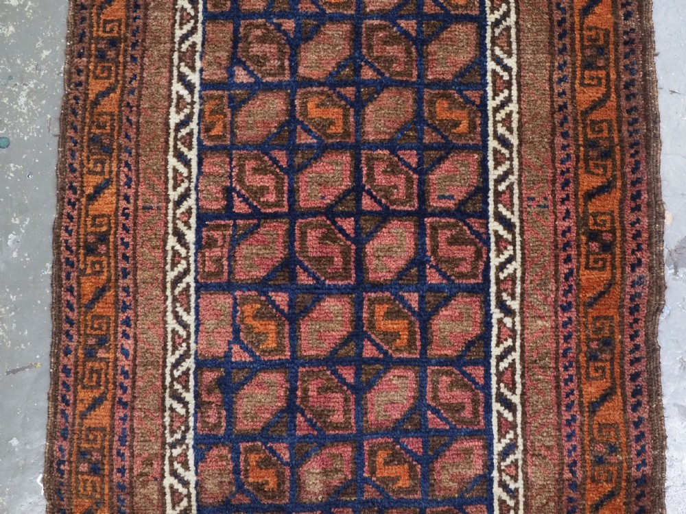ANTIQUE AFGHAN BALUCH PUSHTI FACE WITH 'TILE' DESIGN, CIRCA 1900. View III