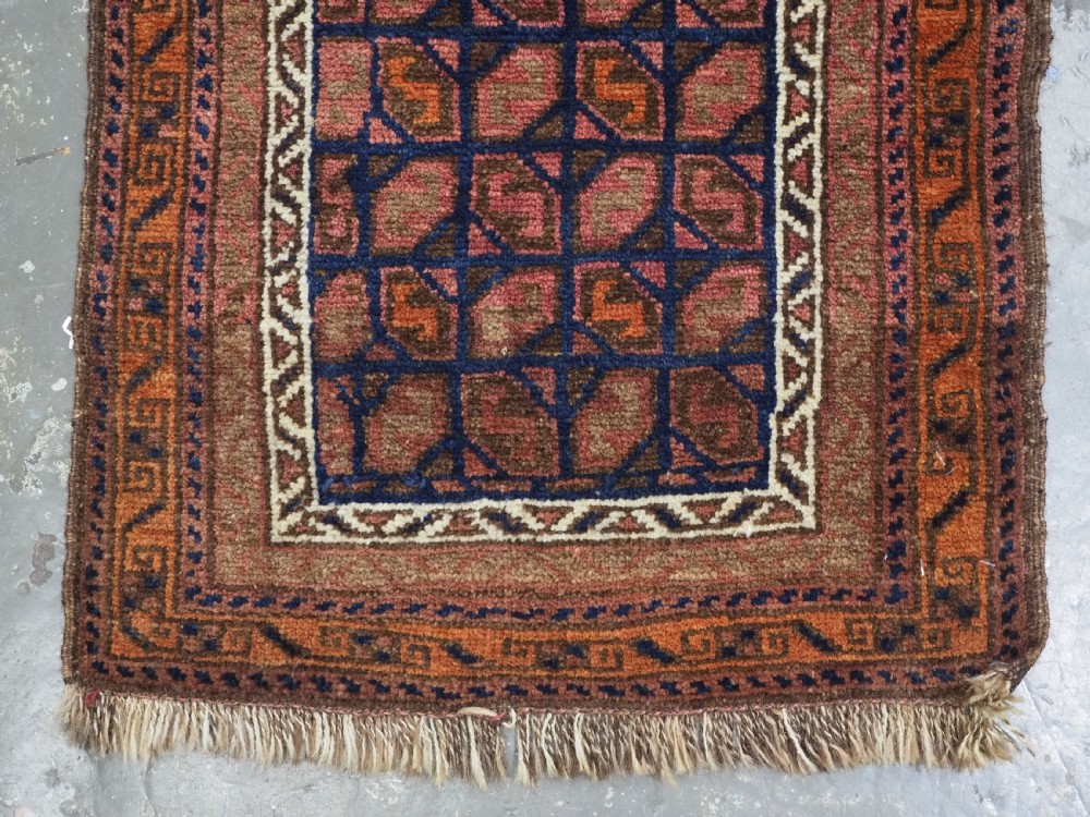 ANTIQUE AFGHAN BALUCH PUSHTI FACE WITH 'TILE' DESIGN, CIRCA 1900. View IV