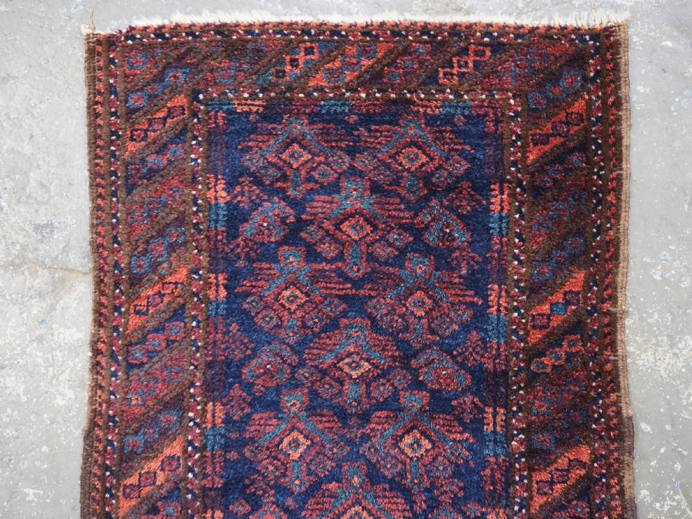 ANTIQUE SISTAN BALUCH PUSHTI FACE WITH TRADITIONAL DESIGN, CIRCA 1900. View II