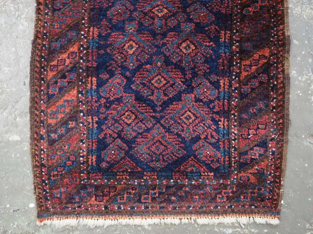 ANTIQUE SISTAN BALUCH PUSHTI FACE WITH TRADITIONAL DESIGN, CIRCA 1900. View IV