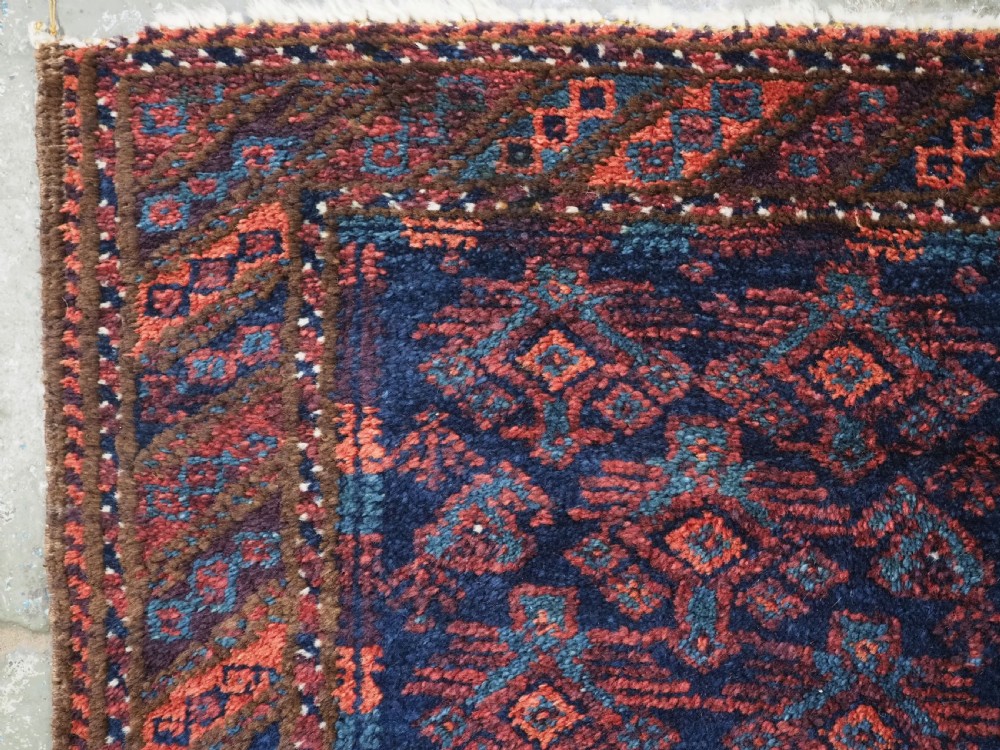 ANTIQUE SISTAN BALUCH PUSHTI FACE WITH TRADITIONAL DESIGN, CIRCA 1900. View V
