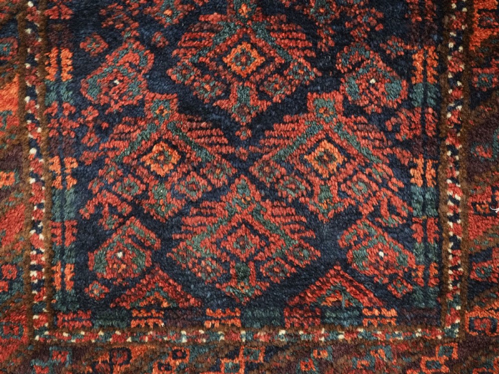 ANTIQUE SISTAN BALUCH PUSHTI FACE WITH TRADITIONAL DESIGN, CIRCA 1900. View VIII