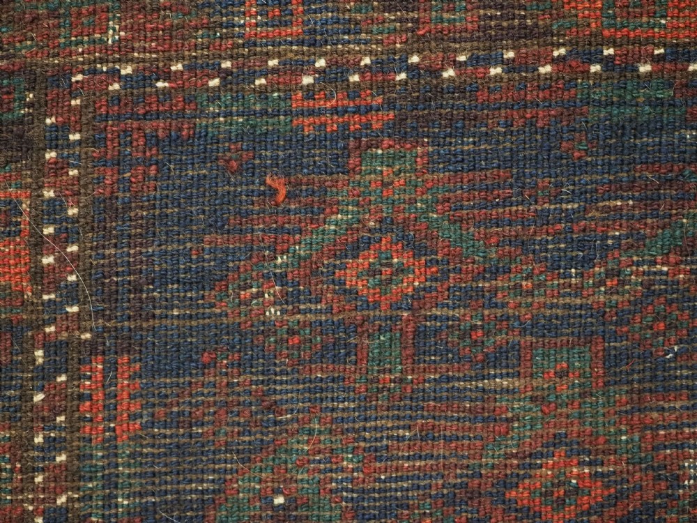 ANTIQUE SISTAN BALUCH PUSHTI FACE WITH TRADITIONAL DESIGN, CIRCA 1900. View IX