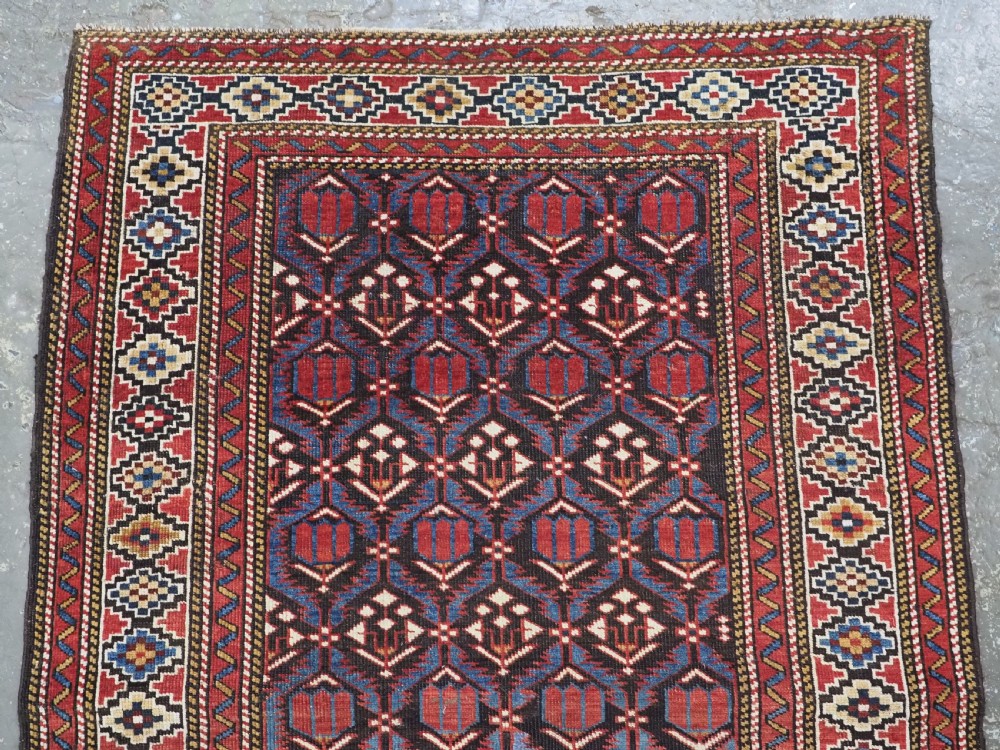 ANTIQUE CAUCASIAN SHIRVAN BAKU REGION RUG WITH 'TULIPS IN LATTICE' DESIGN, CIRCA 1890.  View III