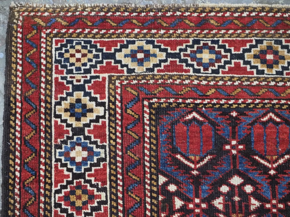 ANTIQUE CAUCASIAN SHIRVAN BAKU REGION RUG WITH 'TULIPS IN LATTICE' DESIGN, CIRCA 1890.  View VI