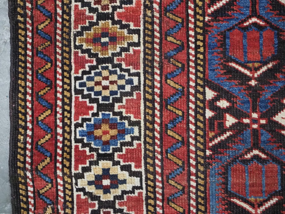 ANTIQUE CAUCASIAN SHIRVAN BAKU REGION RUG WITH 'TULIPS IN LATTICE' DESIGN, CIRCA 1890.  View VII