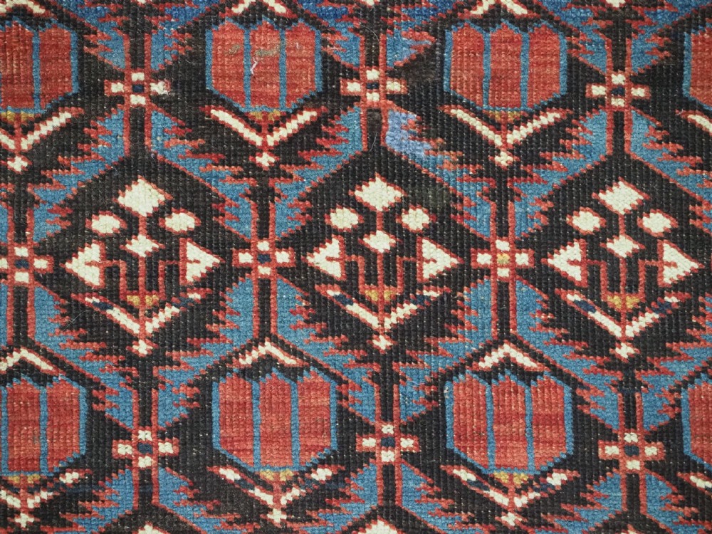 ANTIQUE CAUCASIAN SHIRVAN BAKU REGION RUG WITH 'TULIPS IN LATTICE' DESIGN, CIRCA 1890.  View IX