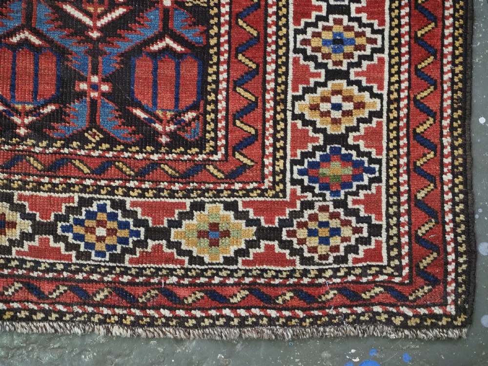 ANTIQUE CAUCASIAN SHIRVAN BAKU REGION RUG WITH 'TULIPS IN LATTICE' DESIGN, CIRCA 1890.  View XI