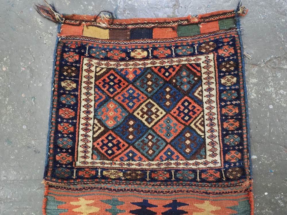 An antique 19th-century Jaf Kurd woven bag featuring a knotted pile upper panel with geometric diamond lattice motifs and a colourful flatweave back section. View III