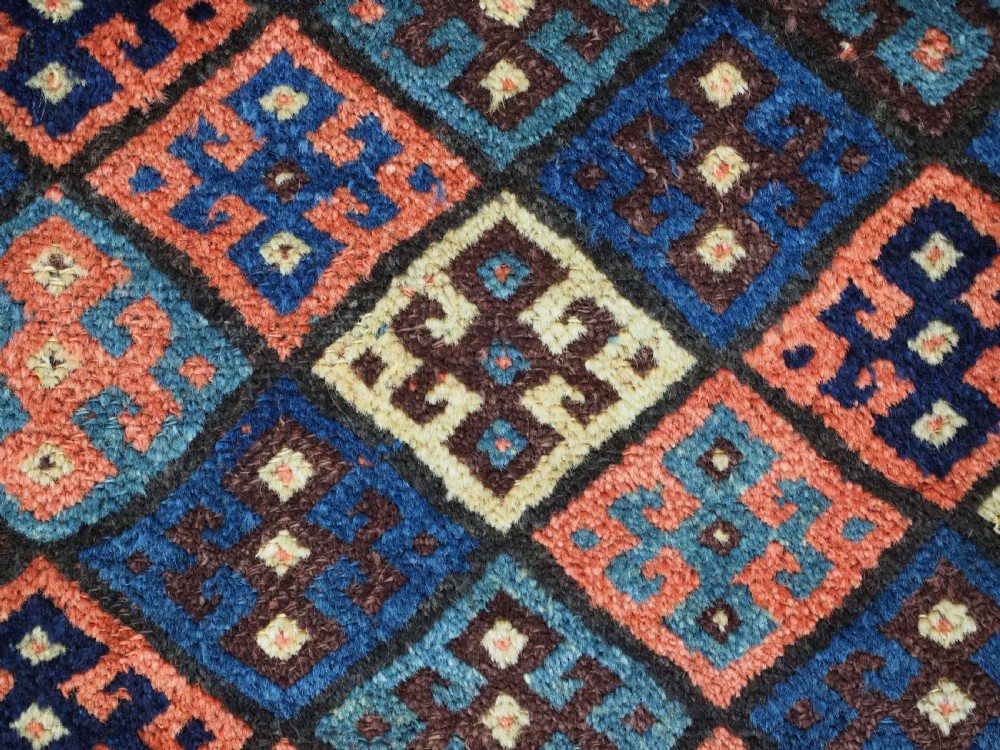 An antique 19th-century Jaf Kurd woven bag featuring a knotted pile upper panel with geometric diamond lattice motifs and a colourful flatweave back section. View VIII