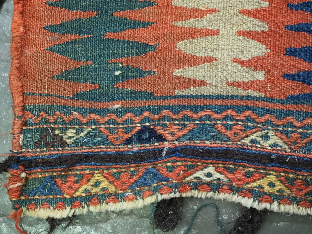 An antique 19th-century Jaf Kurd woven bag featuring a knotted pile upper panel with geometric diamond lattice motifs and a colourful flatweave back section. View XII