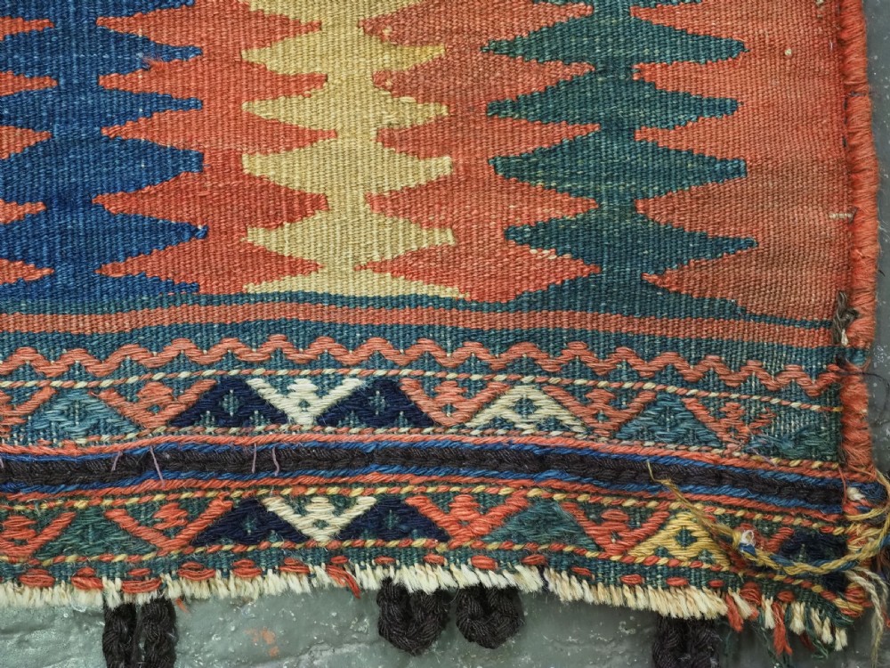 An antique 19th-century Jaf Kurd woven bag featuring a knotted pile upper panel with geometric diamond lattice motifs and a colourful flatweave back section. View XIII