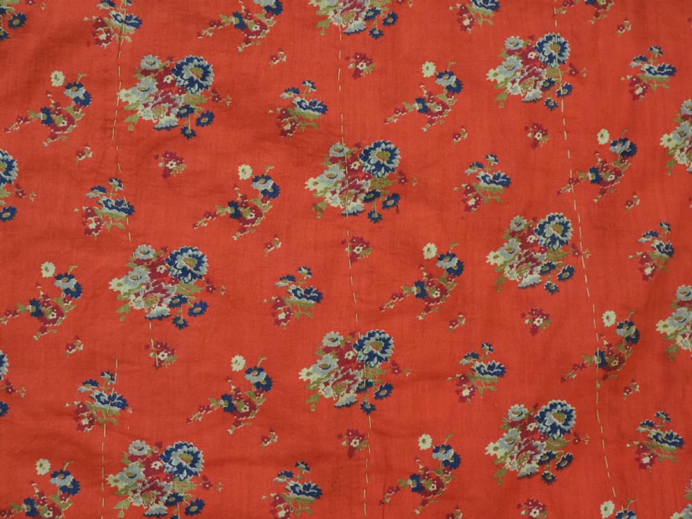 A rectangular magenta pink cotton textile embroidered with circular floral medallions in yellow, blue, and white silk threads. View XII
