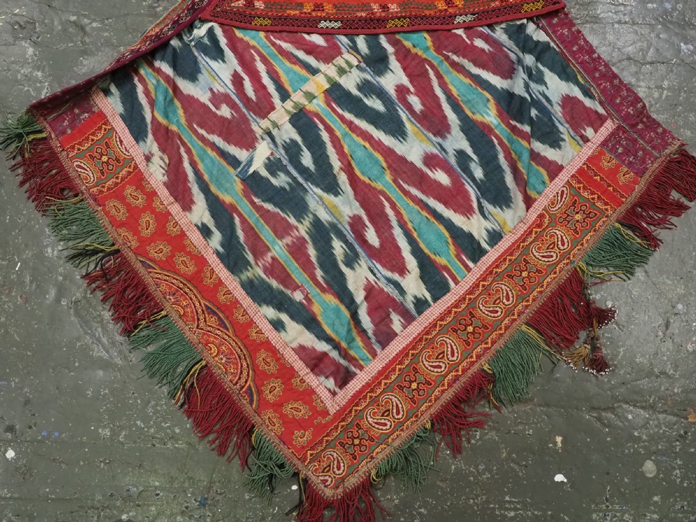 A RARE UZBEK KARAKALPAK LADIES EMBROIDERED WEDDING VEIL WITH SILK IKAT BACK, 19TH CENTURY. View IV