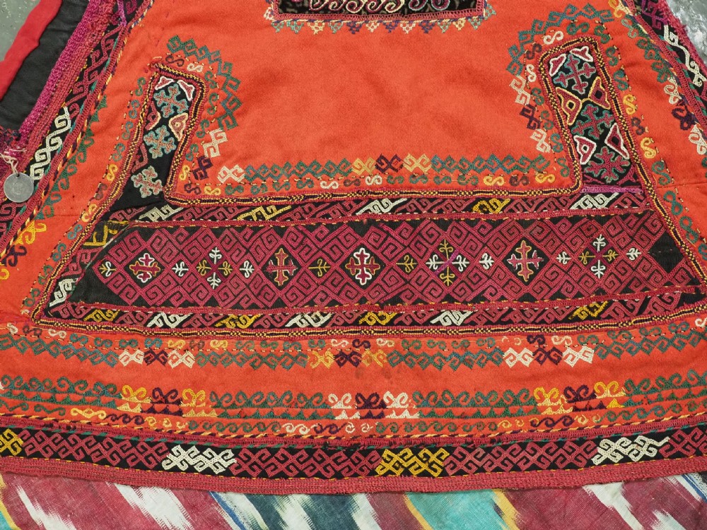A RARE UZBEK KARAKALPAK LADIES EMBROIDERED WEDDING VEIL WITH SILK IKAT BACK, 19TH CENTURY. View V