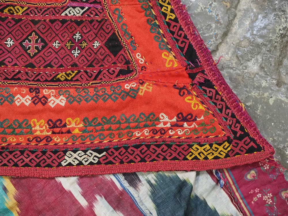 A RARE UZBEK KARAKALPAK LADIES EMBROIDERED WEDDING VEIL WITH SILK IKAT BACK, 19TH CENTURY. View VI