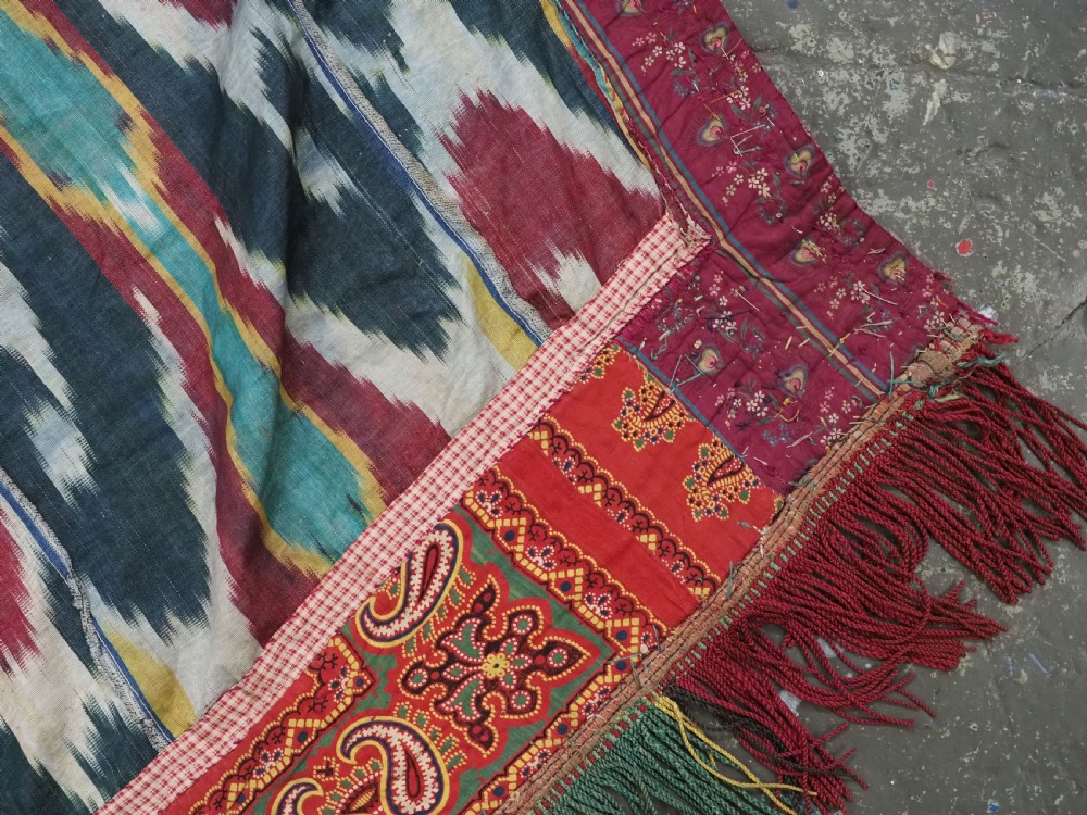 A RARE UZBEK KARAKALPAK LADIES EMBROIDERED WEDDING VEIL WITH SILK IKAT BACK, 19TH CENTURY. View VII