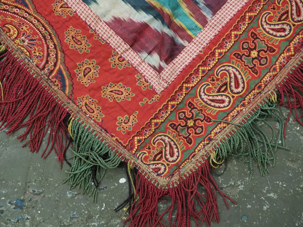 A RARE UZBEK KARAKALPAK LADIES EMBROIDERED WEDDING VEIL WITH SILK IKAT BACK, 19TH CENTURY. View VIII