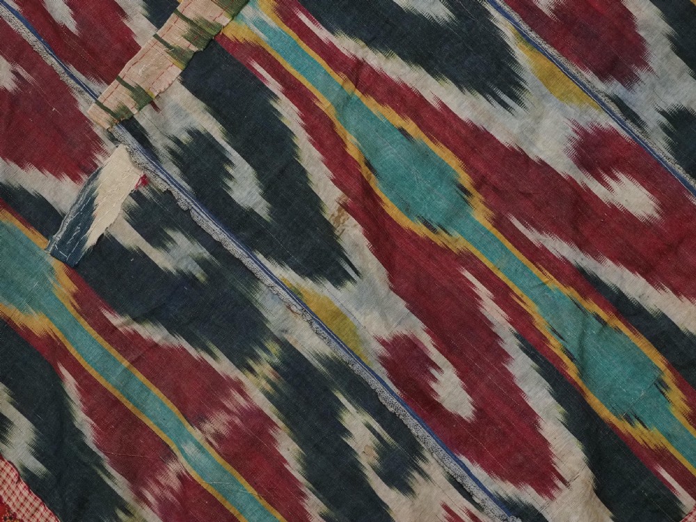 A RARE UZBEK KARAKALPAK LADIES EMBROIDERED WEDDING VEIL WITH SILK IKAT BACK, 19TH CENTURY. View X