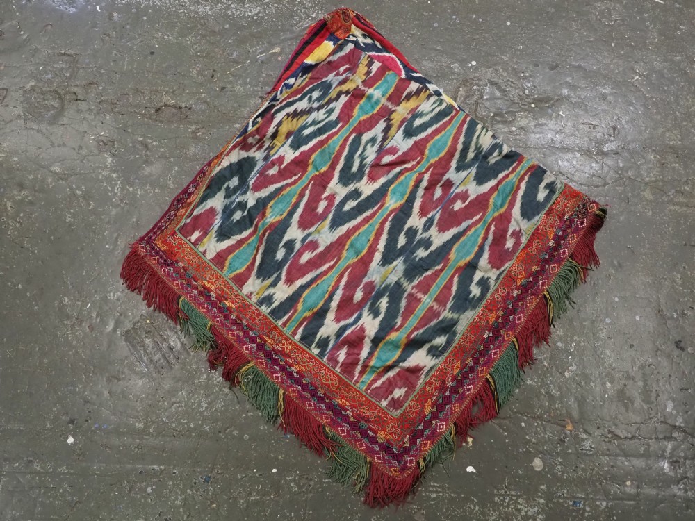 A RARE UZBEK KARAKALPAK LADIES EMBROIDERED WEDDING VEIL WITH SILK IKAT BACK, 19TH CENTURY. View XII