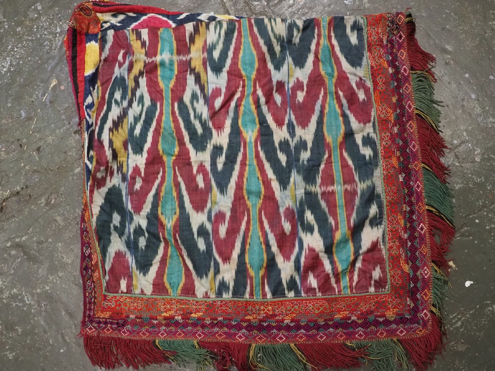 A RARE UZBEK KARAKALPAK LADIES EMBROIDERED WEDDING VEIL WITH SILK IKAT BACK, 19TH CENTURY. View XIII