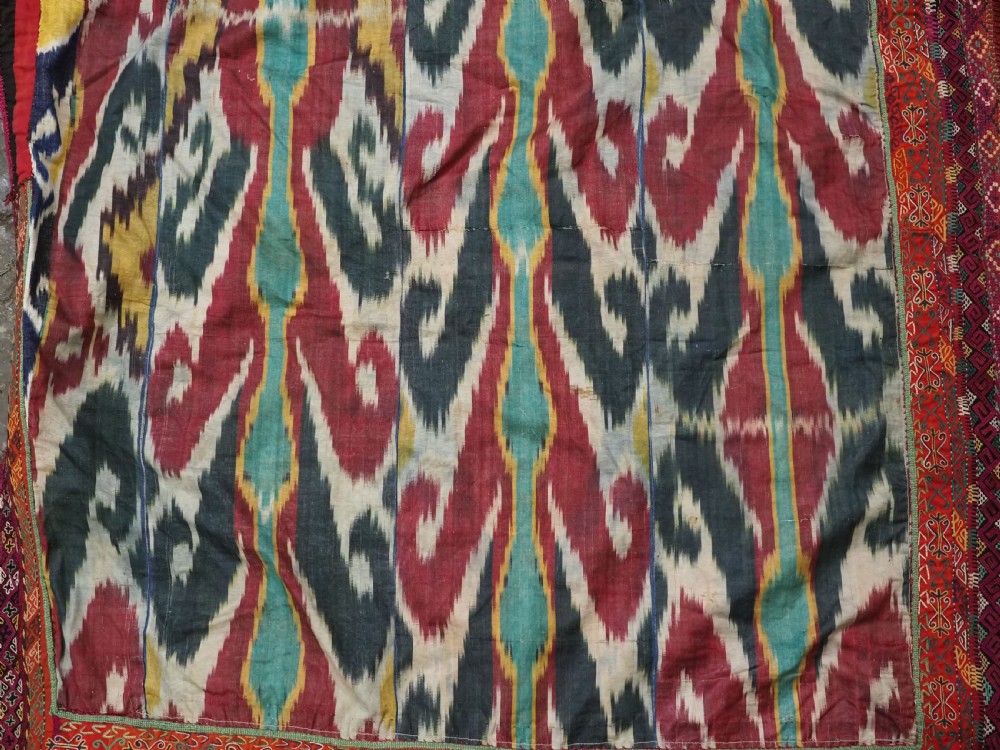 A RARE UZBEK KARAKALPAK LADIES EMBROIDERED WEDDING VEIL WITH SILK IKAT BACK, 19TH CENTURY. View XIV