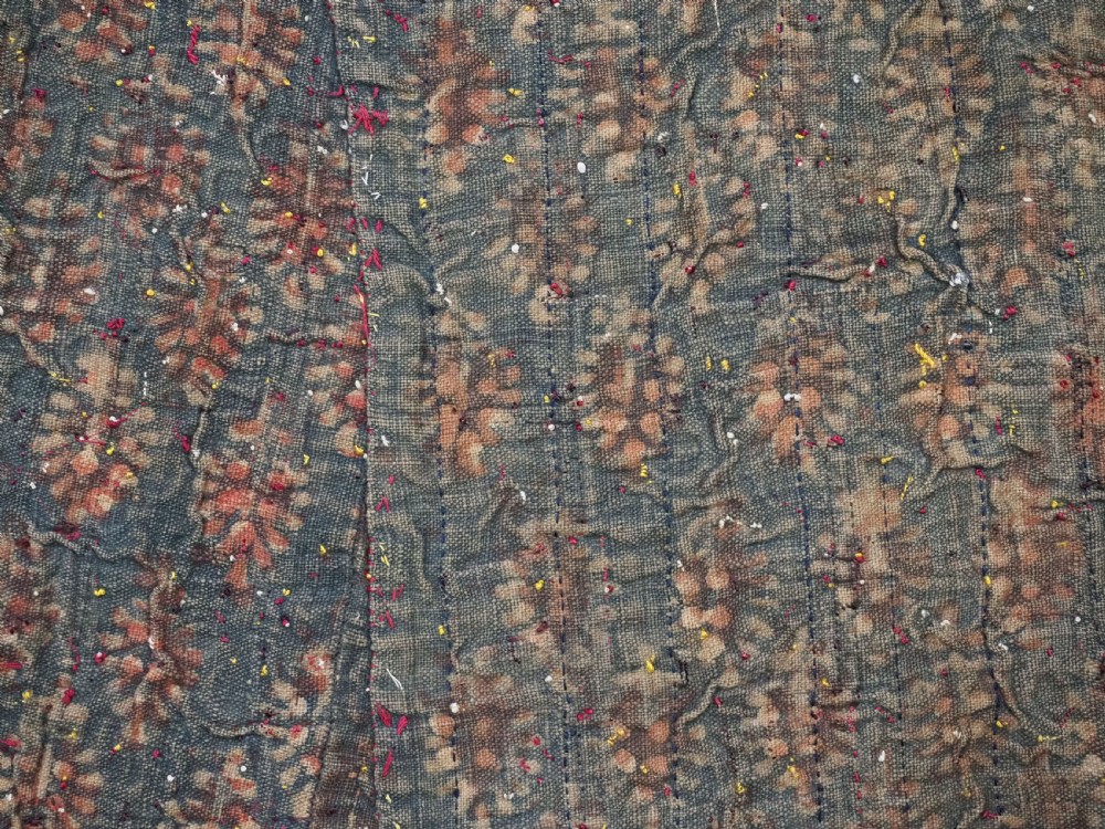 An antique 19th-century Turkmen chyrpy ceremonial coat featuring dense red, yellow, and white silk hand embroidery on a dark base with fringed borders. View XIV
