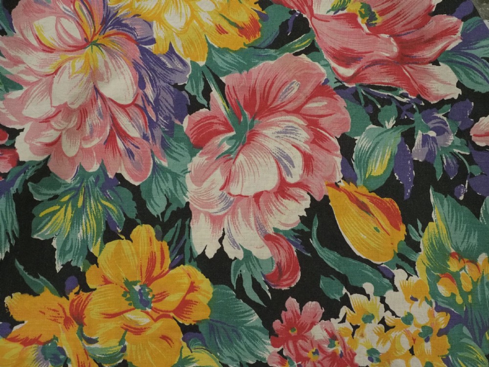 A rectangular red adras silk and cotton textile featuring yellow and white silk thread embroidery with a central circular floral medallion, surrounding floral sprays, and a matching decorative border. View XI