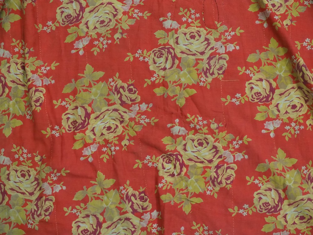 An antique Uzbek silk ikat coat featuring repeating diamond pattern motifs in red, yellow, green, and purple shades with flared sleeves. View XIII
