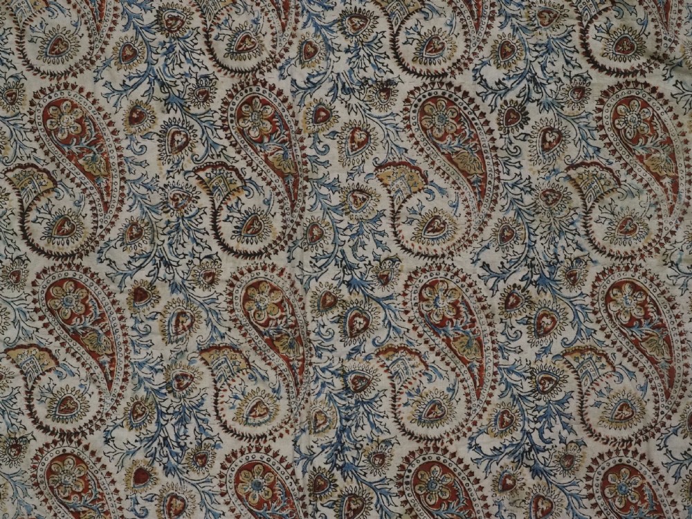 An early 20th-century Uzbek Lakai embroidered saddle cover featuring vibrant silk boteh and floral motifs on a grey ground with colourful fringe trim. View XVI