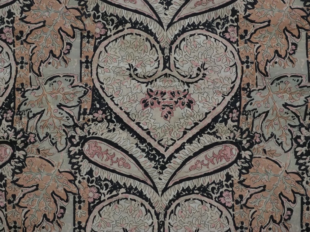 A square black textile decorated with dense multicoloured silk embroidery displaying floral and paisley motifs with fringed edges. View XVII