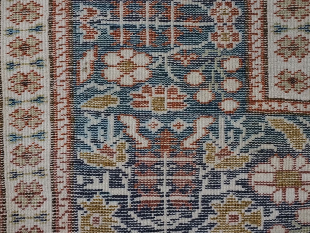An antique Turkish Panderma hand-knotted wool prayer rug featuring a navy central niche with a floral motif surrounded by detailed ivory and rust geometric floral borders. View XIV