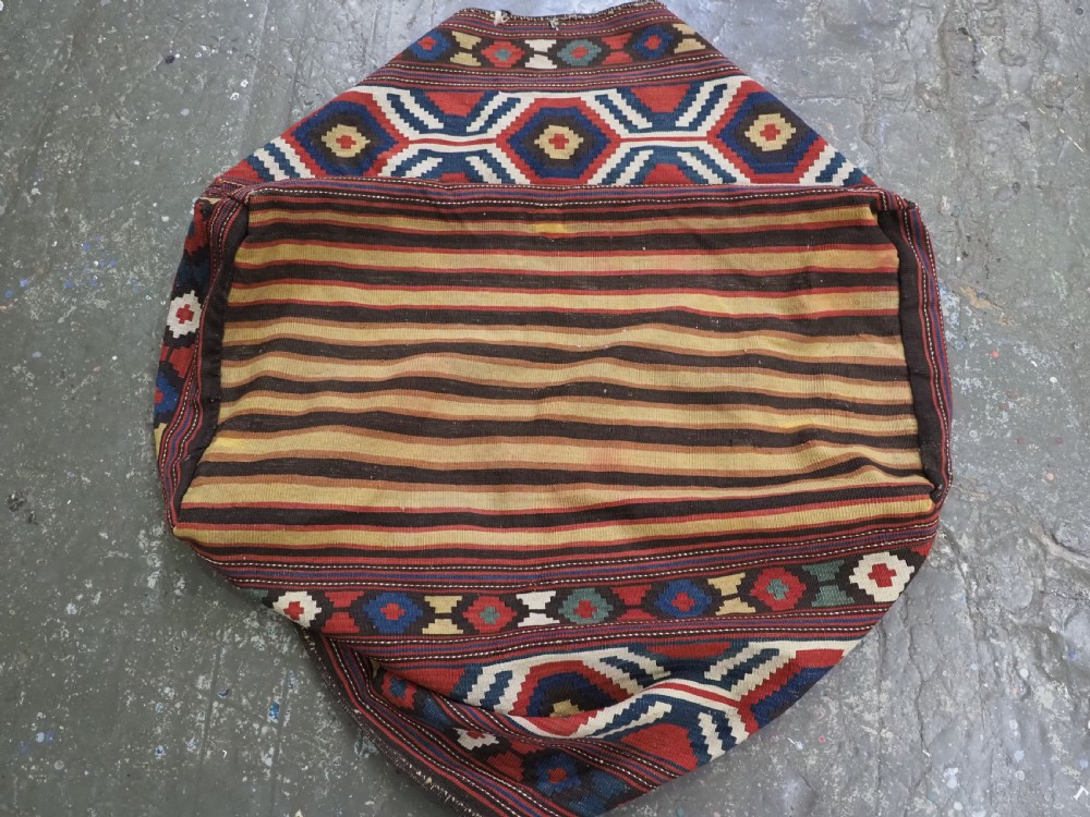 An antique hand-woven rectangular Caucasian mafrash storage bag decorated with red, blue, cream, and yellow geometric soumak patterns. View VII