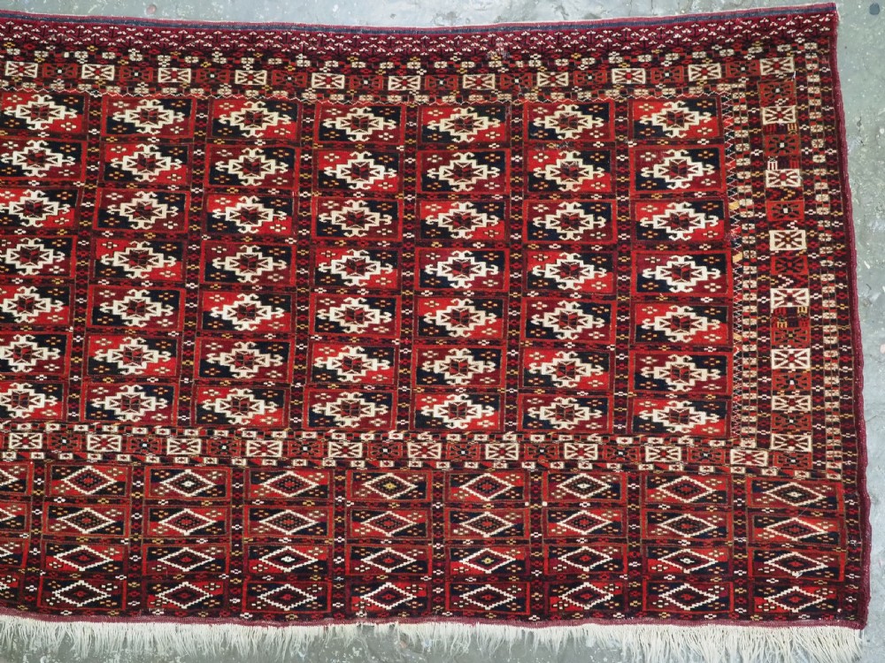 ANTIQUE TEKKE TURKMEN CHUVAL FACE OF SCARCE FORMAT WITH AINA GUL DESIGN, CIRCA 1880. View IV